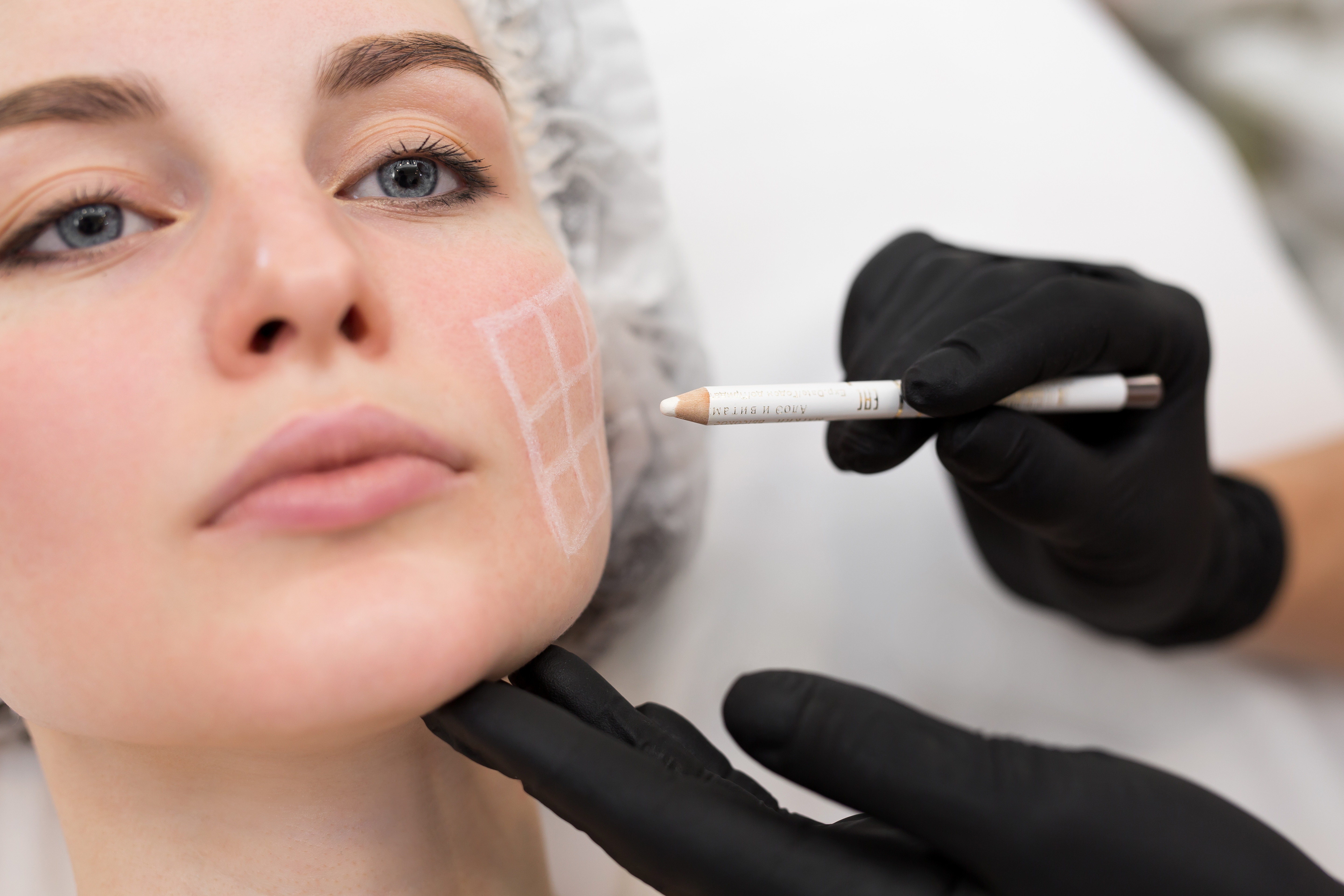 Provider assessing facial contours before a Bio-LIFT treatment at Desert Med Rejuvenation.