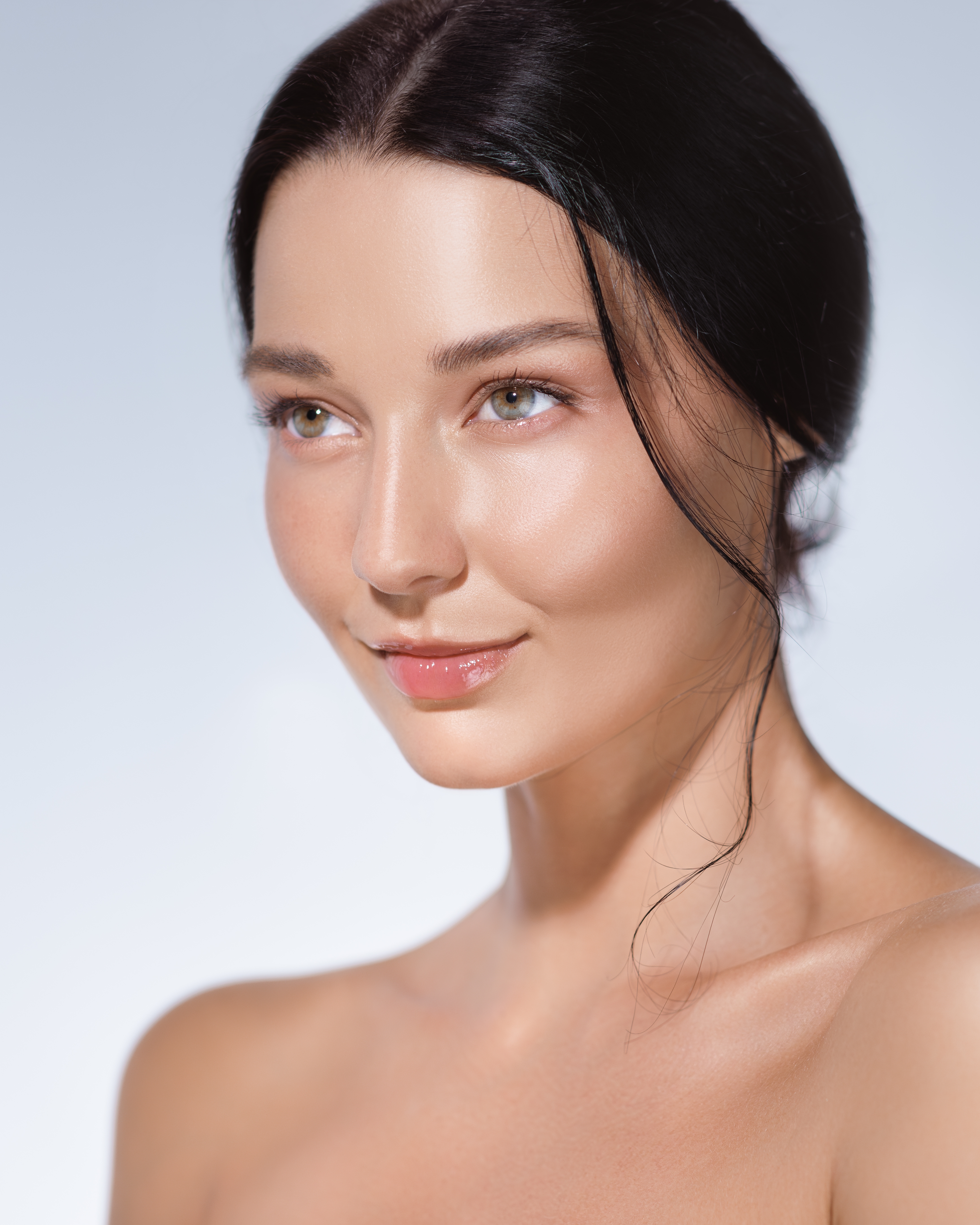 Woman with glowing, hydrated skin after a HydraFacial at Desert Med Rejuvenation.
